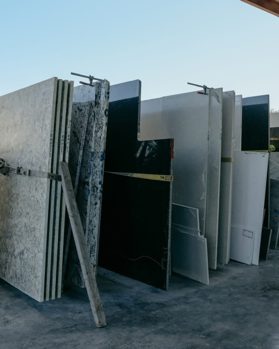 Rows of granite and quartz slabs in the slab yard